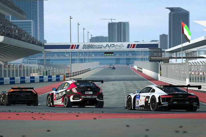 Experience the rush as you soar through the Dubai Autodrome with a professional driver mastering every curve on this stunning racetrack where speed meets precision in an unforgettable ride.